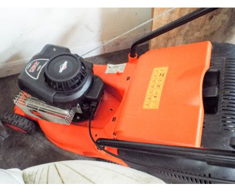 A Flymo Briggs & Stratton engine 148cc petrol lawnmower 