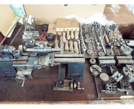 A Pultra watchmakers lathe with large quantities of tools and accessories 