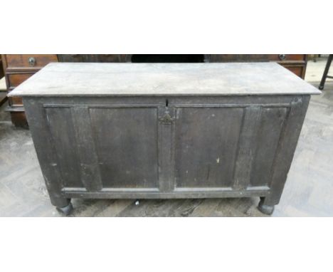 An antique oak four panel coffer  
