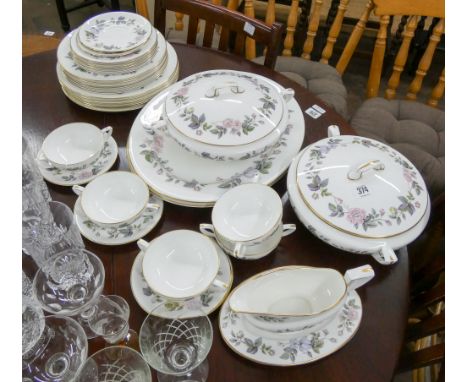 A Royal Worcester June Garland part dinner service, comprising dinner plates, side plates, bread and butter plates, two oval 