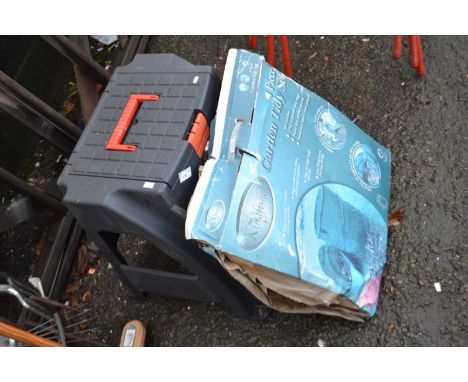 A plastic combination step and tool box together with a garden tidy set