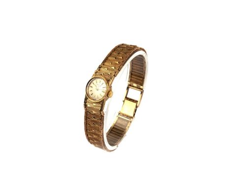 Longines: a 9ct yellow gold cocktail watch, the silvered baton dial fitted a 17-jewel manual wind movement, cal 320, no. 1390