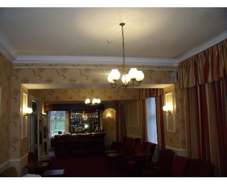 Two five branch brass centre lights, four twin branch matching wall lights and a single branch matching wall light 