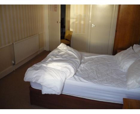 The bedroom contents of room 33, comprising of bed, double door wardrobe, pair of three drawer bedside chests, dressing chest