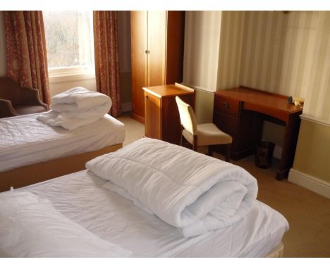 The bedroom contents of room 39, comprising of double bed, single bed, pair of bedside chests, luggage rack and drawers, cabi