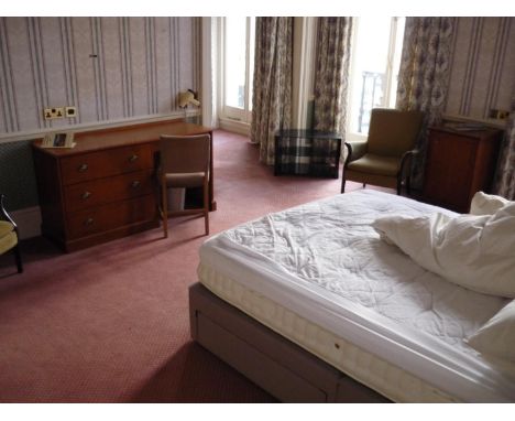 The bedroom contents of room 24, comprising of double bed, dressing chest, easy chairs, TV stand, bedside cupboards, wing bac