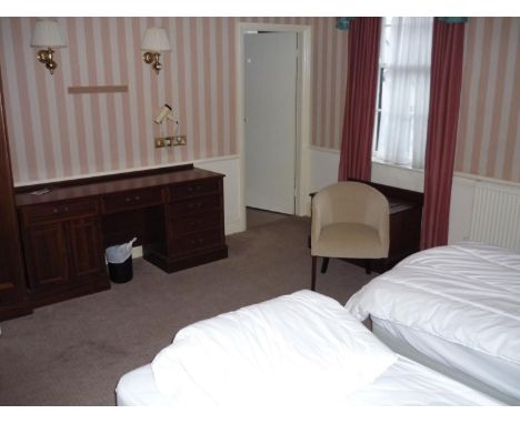 The bedroom contents of room 31, comprising of double door wardrobe, dressing chest, luggage rack and drawers, bedside cabine