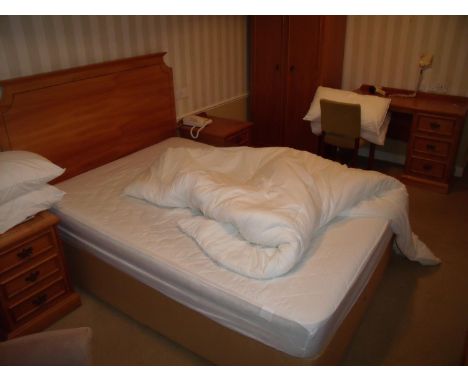 The bedroom contents of room 64, comprising of double bed, two chairs, two three drawer bedside chests, double door wardrobe,