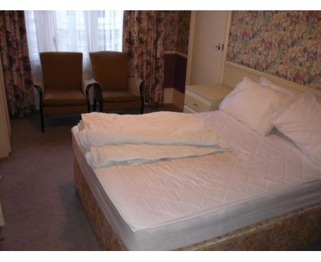 The bedroom contents of bedroom 15, comprising of double bed, bedside cupboards, luggage rack, wardrobe, dressing chest, easy