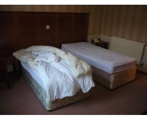 The bedroom contents of bedroom 16, comprising of two single beds, bedside cupboards, tub chair, two door wardrobe, dressing 