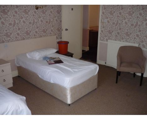 The bedroom contents of room 28, comprising of two single beds, fixed bedroom furniture, free standing dressing chest, luggag