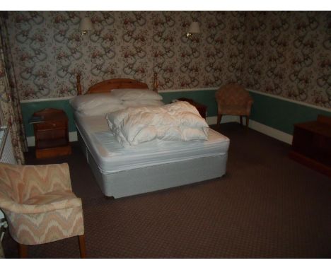 The bedroom contents of room 46, comprising of double bed, pair of bedside chests, luggage rack, tub chairs, dressing table s