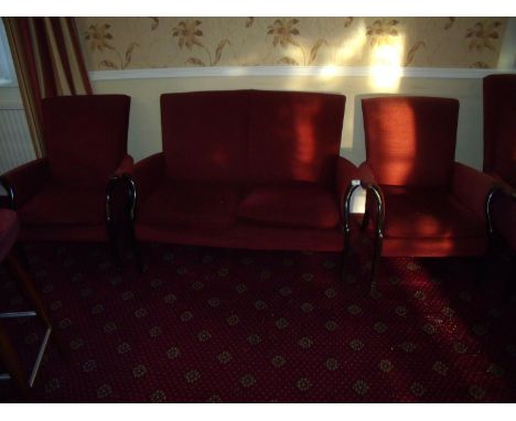 Three piece suite comprising of two seat sofa and matching armchairs with wooden trim 