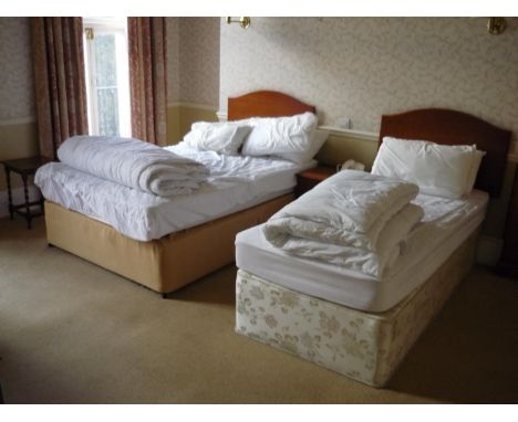 The bedroom contents of bedroom 22, comprising of free standing double door wardrobe, double bed, single bed, bedside chest, 