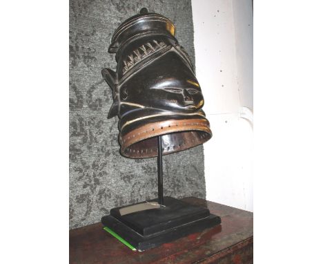 MENDE HELMET MASK, carved wood, with traces of paint, 48cm H plus a display stand.