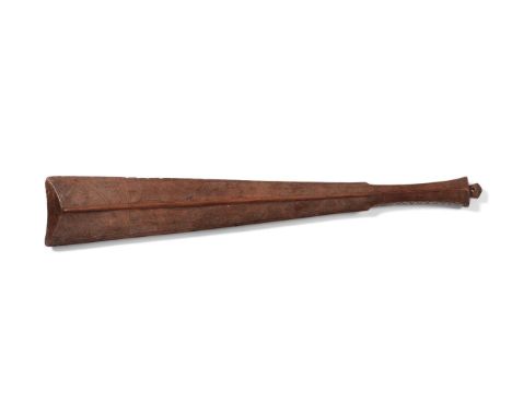 An Early 20th Century Samoan Sword Club, of light coloured hardwood, the blade with raised medial ridge to each side, the cha