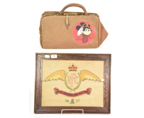 A First World War Royal Flying Corps Embroidered Panel, worked with the crest, motto and date 1917, 32 cm by 42 cm, oak frame