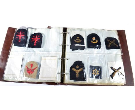 A Collection of British Army and Navy Cloth Insignia, including shoulder boards, skill-at-arms and trade badges, rank stripes