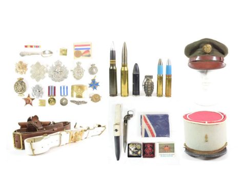 Militaria, including a Sam Browne, a buff waist belt, inert mortar shells, US Army peaked cap, French Kepi, cap badges, sweet