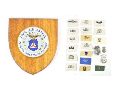 A US Army Military Police Breast Badge, the reverse stamped L.I.G.I., with pin fastening; a US Army Special Forces Breast Bad