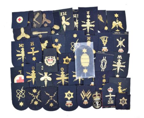 A Collection of Forty Three Royal Navy Ratings Badges, embroidered in gold bullion thread on blue wool, including Seaman Gunn