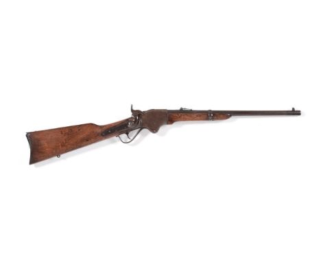 A Spencer Repeating Rifle Company Contract Model 1865 Carbine, the 51cm round barrel stamped MODEL 1865 behind the hinged lad