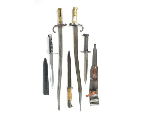 Five Bayonets:- a German Model S84/98nA Second Pattern sawback/carbine knife bayonet, the blade stamped GEBR. HELLER, MARIENT