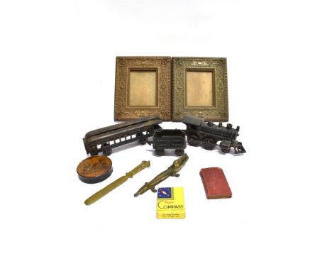 ASSORTED COLLECTABLES  comprising a North American style cast iron carpet train; a pair of picture frames with embossed brass