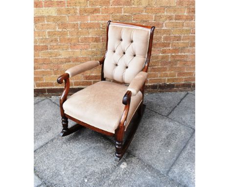 A ROSEWOOD FRAMED ROCKING ARMCHAIR  with button upholstery