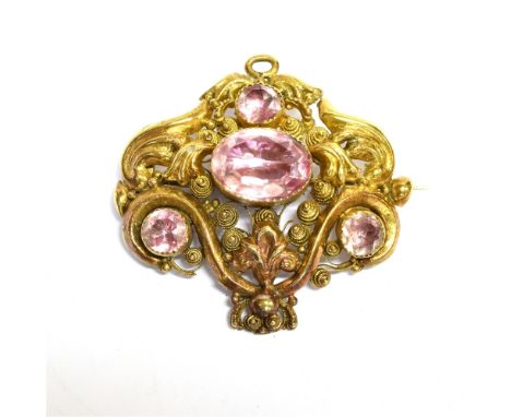 AN EARLY VICTORIAN REPOUSSE GOLD AND PINK FOIL-BACKED QUARTZ FOUR STONE CANNETILLE BROOCH  the back with a glazed oval panel 