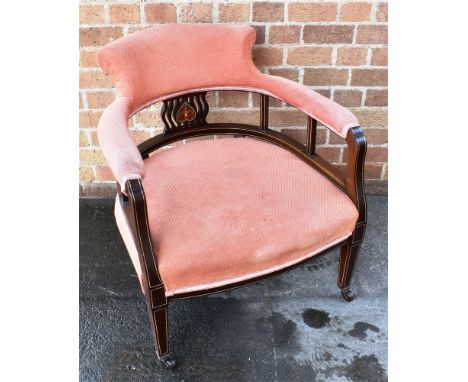 A PAIR OF EDWARDIAN ROSEWOOD FRAMED ARMCHAIRS  with marquetry inlaid decoration, on square tapering supports with ceramic cas