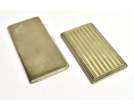 TWO EARLY 20TH CENTURY SILVER ENGINE TURNED RECTANGULAR CIGARETTE CASES one engraved with script initials 'CHG' in a panel, m