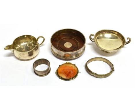 A VICTORIAN SILVER SHALLOW CREAM JUG AND A SMALL COLLECTION OF MISCELLANEOUS SMALL SILVER The cream jug with a scroll handle,