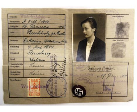 MILITARIA - GERMAN THIRD REICH  A Deutsches Reich Kennkarte, 1940, 'Westerland-Sylt'; together with an enamel N.S.D.A.P. memb