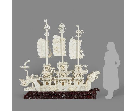 Massive Chinese carved hardstone dragon ship. Decorated throughout with dragon and phoenix motifs. With three large sails, ch