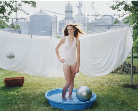 Angela Strassheim (American, b. 1969). Chromogenic color print titled "Alicia in the Pool" depicting a girl in a bathing suit