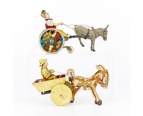 Group of two vintage Marx tin wind-up toys. Both antique toys are lithographed and in the form of a donkey pulling a carriage