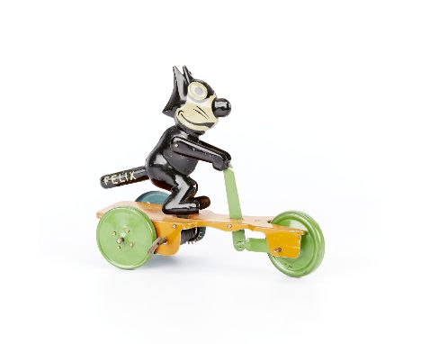 Wind-up lithographed tin toy in the form of Felix the Cat riding a three-wheeled scooter, ca. 1920s. Possibly made by S.G. Gu