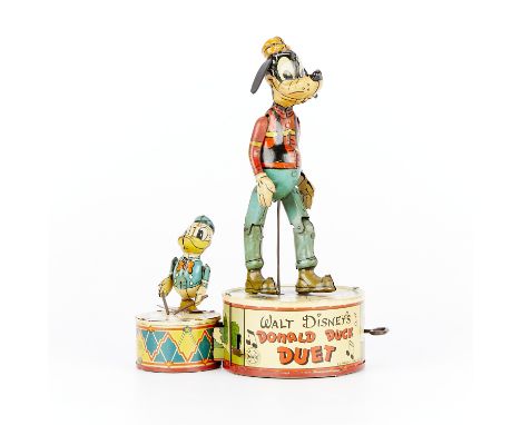 Marx &amp; Co. tin lithographed wind-up toy titled "Walt Disney's Donald Duck Duet" depicting Goofy and Donald Duck on a plat