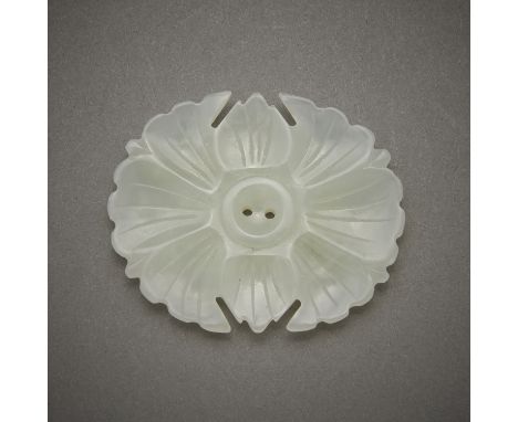 Carved Chinese pale white jade toggle in the form of a blossoming flower. With two holes drilled in the center.Height: 1 3/4 