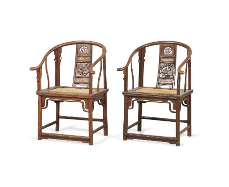 Pair of rare mid-19th century Chinese elm wood horseshoe back quanyi chairs. Each with a U-form crestrail. Each with a carved