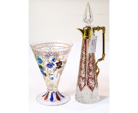 A Bohemian ruby flashed and cut ewer, of tapered cylindrical outline, with French ormolu mounts, glass stopper, finely carved