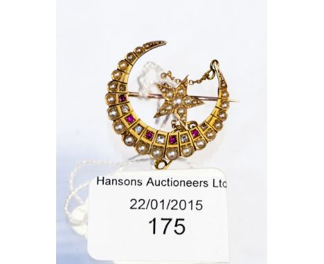 A 15ct gold pearl, diamond and ruby brooch in the shape of a crescent with a star