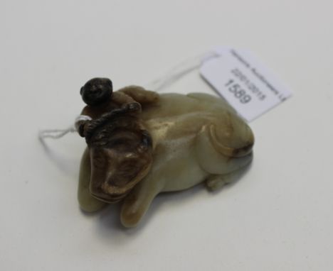 A Chinese grey jade small carved figure of a boy on a buffalo