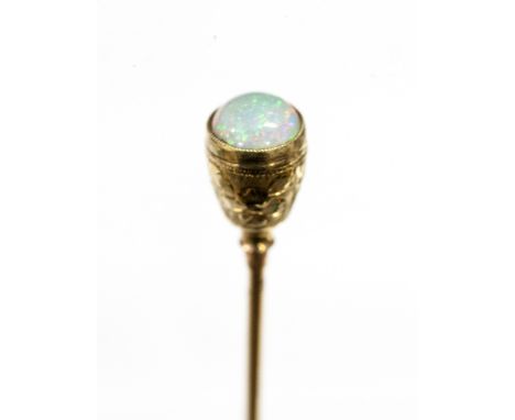 Tiffany & Co - A gold and opal hat pin, set with a round cabachon stone, in a foliate engraved mount, stamped Tiffany & Co, 1