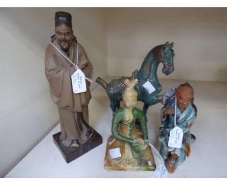 A collection of Chinese figures, comprising a terracotta figure of a horse, with a broken leg, a figure of a Buddha, with a b