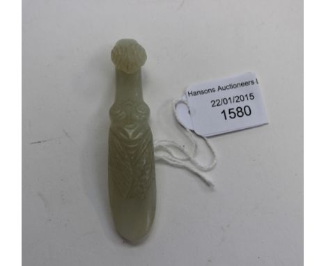 An unusual jade belt buckle, the shank carved as a cicada, its hook as the head of a bird
