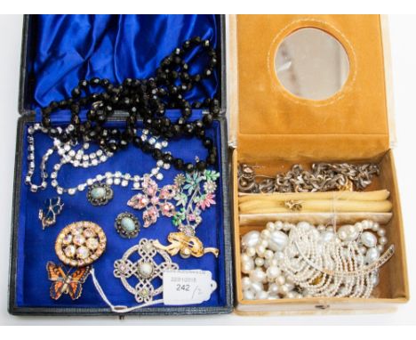 A leather jewel box with paste necklace, French jet necklace, brooches, etc and another 'Hers' jewel box with gold filial sti