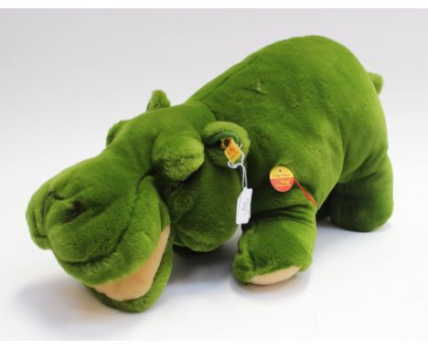 A Steiff cosy hippo teddy bear in green, retaining button to ear and tag 