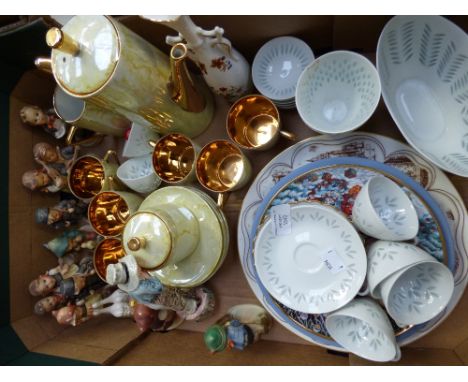 A box of ceramics including Hummel figures, yellow lustre coffee wares 